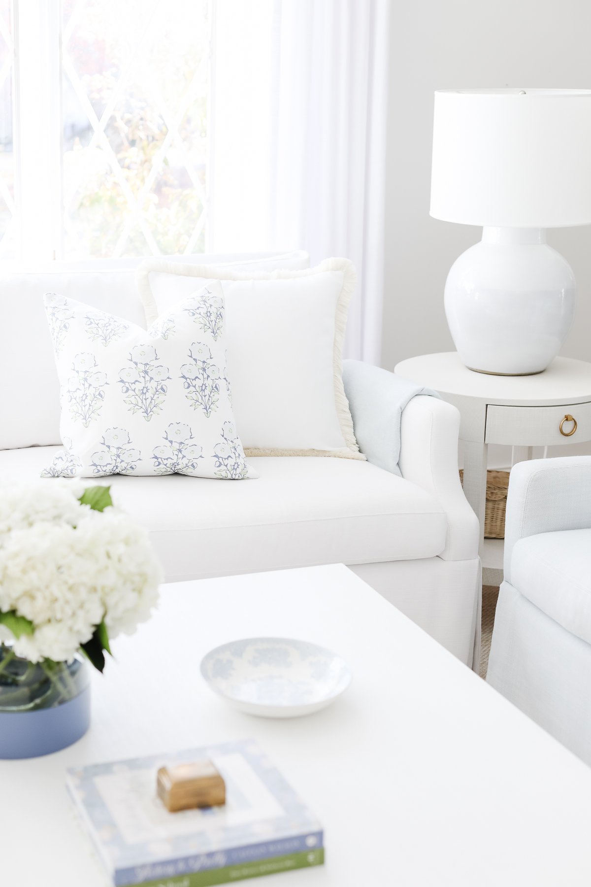 Before and after, a white couch in a living room.