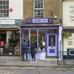 Photograph of the shop front of Dotty Di's yarn shop and its neighbours.