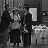 Charles Chaplin, Edna Purviance, and Ernest Van Pelt in The Tramp (1915)