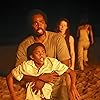 Yunjin Kim, Harold Perrineau, Malcolm David Kelley, and Sayid in Lost (2004)