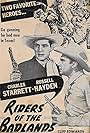 Russell Hayden and Charles Starrett in Riders of the Badlands (1941)