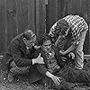 Charles Chaplin, Paddy McGuire, and Ernest Van Pelt in The Tramp (1915)