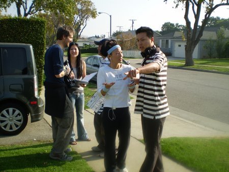 Tom Huang and Tamlyn Tomita setting up for the next shot on the set of "Why Am I Doing This?".