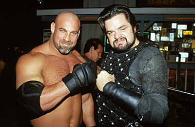 Bill Goldberg (appearing as himself) poses with Oliver Platt (appearing as Jimmy King)