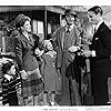 Greer Garson, Richard Ney, and Walter Pidgeon in Mrs. Miniver (1942)