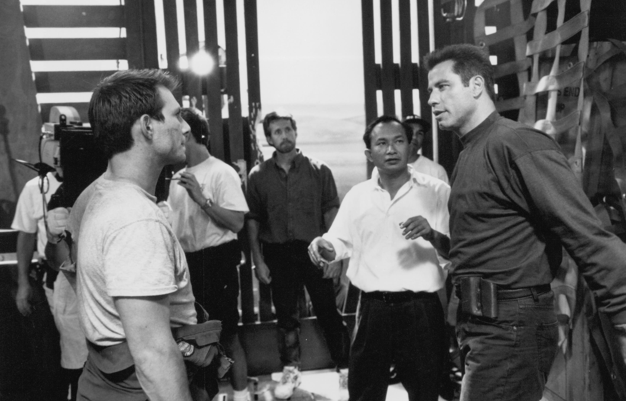 Christian Slater, John Travolta, and John Woo in Broken Arrow (1996)