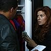 Debra Messing and Laz Alonso in The Mysteries of Laura (2014)