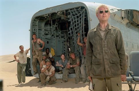 The mysterious and eccentric Elliott (Giovanni Ribisi, foreground) insists that he is the only hope for a group of passengers of a downed plane, including (left to right) Ian (Hugh Laurie), Towns (Dennis Quaid), AJ (Tyrese Gibson), Rady (Kevork Malikyan), Sammi (Jacob Vargas), Kelly (Miranda Otto), Liddle (Scott Michael Campbell) and Jeremy (Kirk Jones). 