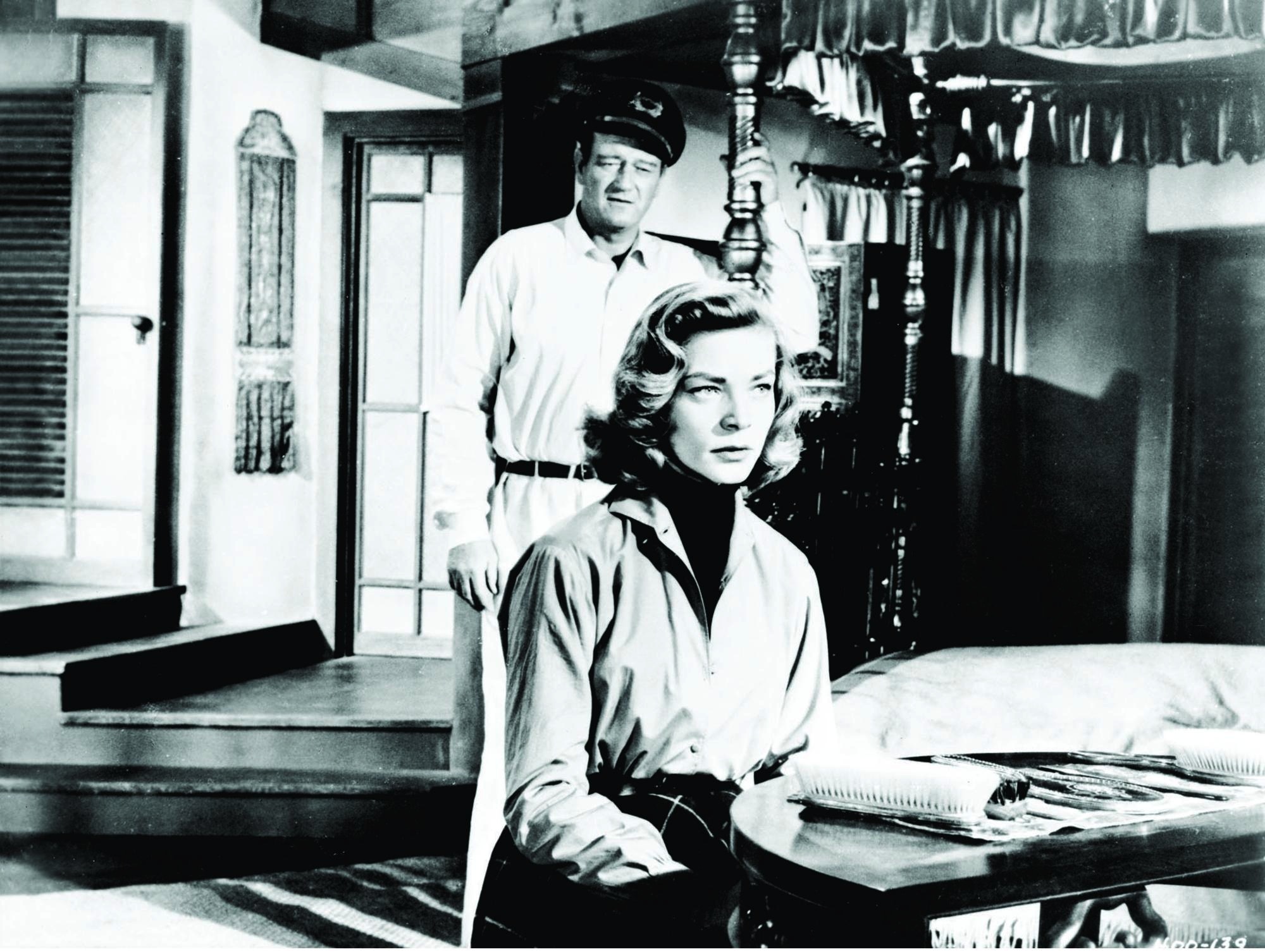 Lauren Bacall and John Wayne in Blood Alley (1955)