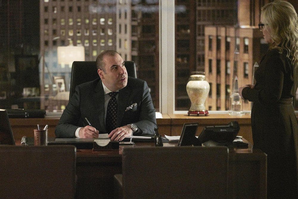 Rachael Harris and Rick Hoffman in Suits (2011)