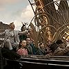 Michael Keaton, Colin Farrell, Douglas Reith, Eva Green, Joseph Gatt, Finley Hobbins, and Nico Parker in Dumbo (2019)