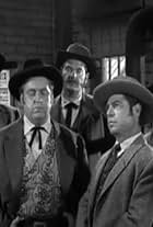 James Arness, Jacques Aubuchon, John Dierkes, and Barney Phillips in Gunsmoke (1955)