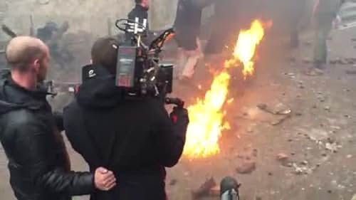 Tony Condren proforming a full body burn on The Maze , Tony plays the part of a army riot police officer that has been injured and is hit with a petrol bomb while on the ground