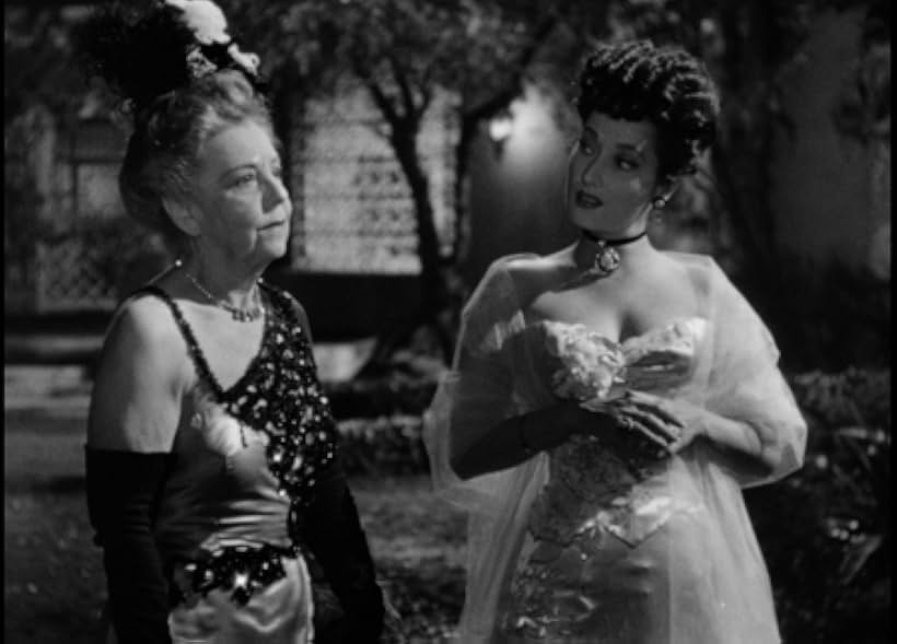 Gloria Lloyd Roberts and Merle Oberon in Temptation (1946)