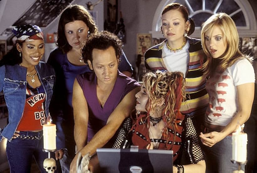 After waking up in the body of a 30-year-old man, Jessica (Rob Schneider, center left) and friends Keecia (Maritza Murray, far left), Hildenburg (Megan Kuhlmann, medium left), Lulu (Alexandra Holden, medium right), and April (Anna Faris, far right) try to figure out how to change him back into a woman with help from the high school witch, Eden (Sam Doumit, front center, right). 