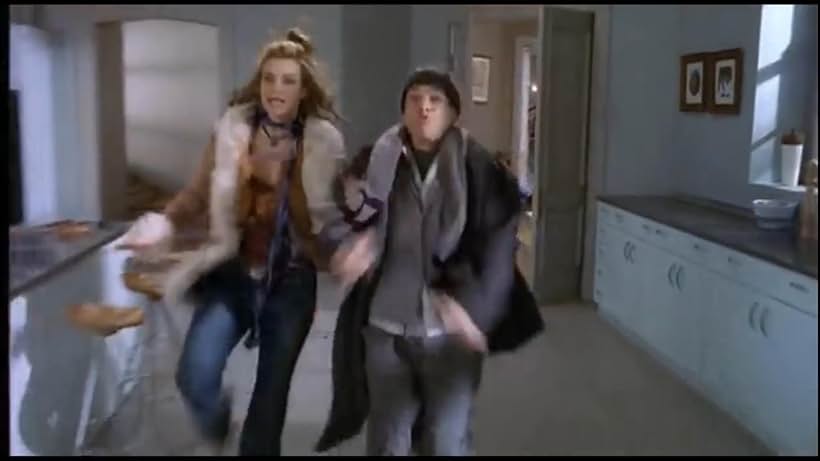 Missi Pyle and French Stewart in Home Alone 4: Taking Back the House (2002)