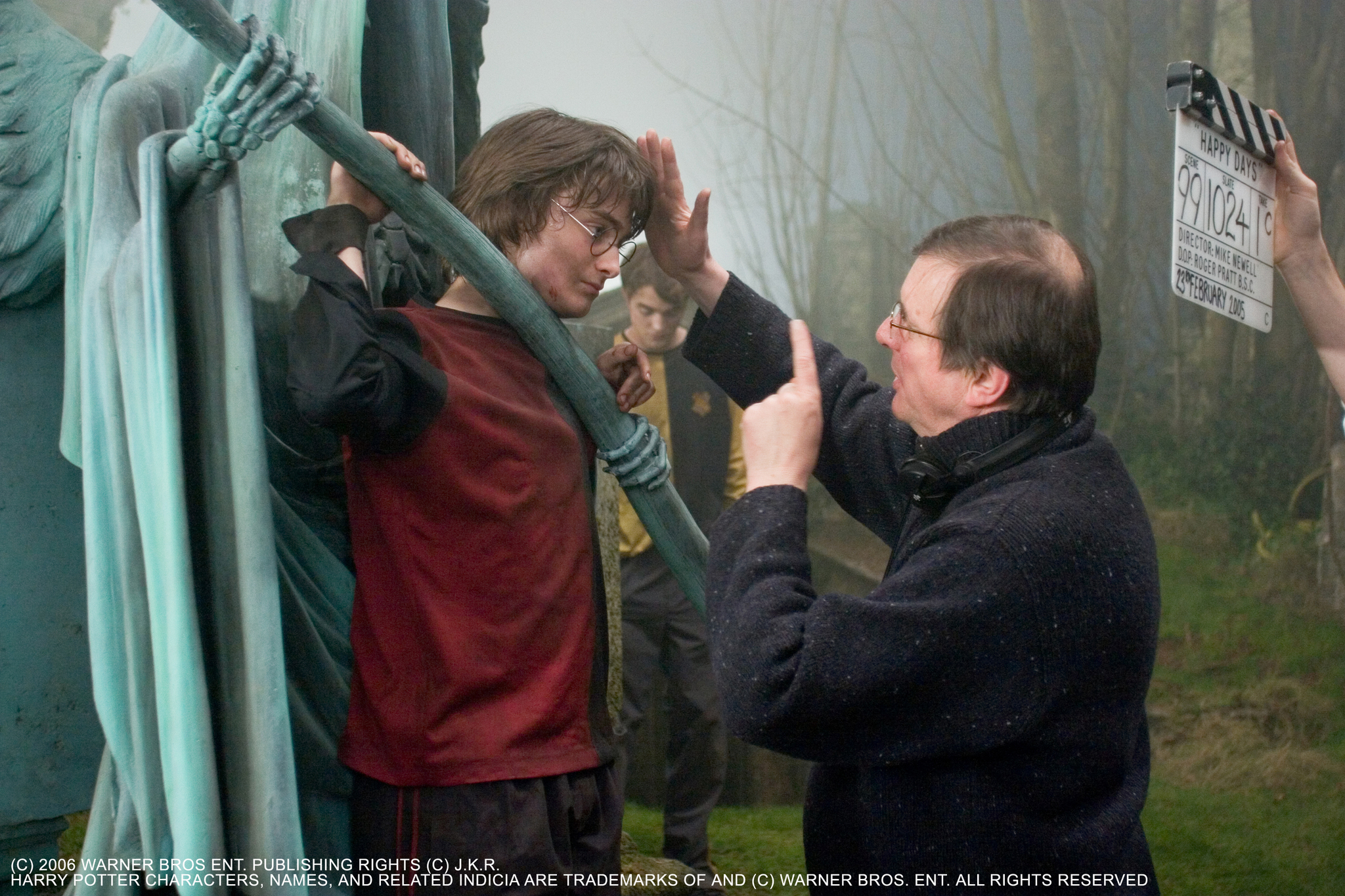 Mike Newell, Daniel Radcliffe, and Robert Pattinson in Harry Potter and the Goblet of Fire (2005)