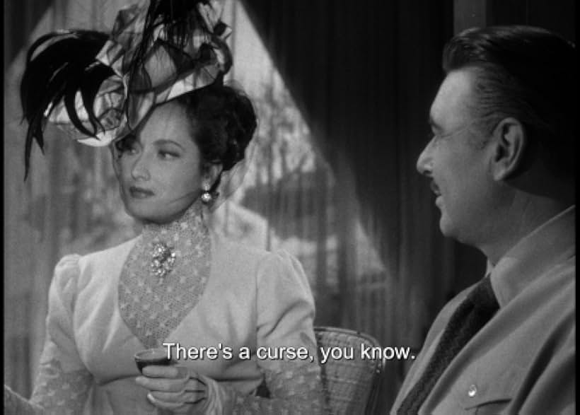 George Brent and Merle Oberon in Temptation (1946)