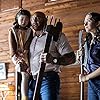 Dave Bautista, Kristen Cui, and Abby Quinn in Knock at the Cabin (2023)