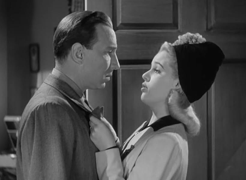 Mary Beth Hughes and Lloyd Nolan in Dressed to Kill (1941)