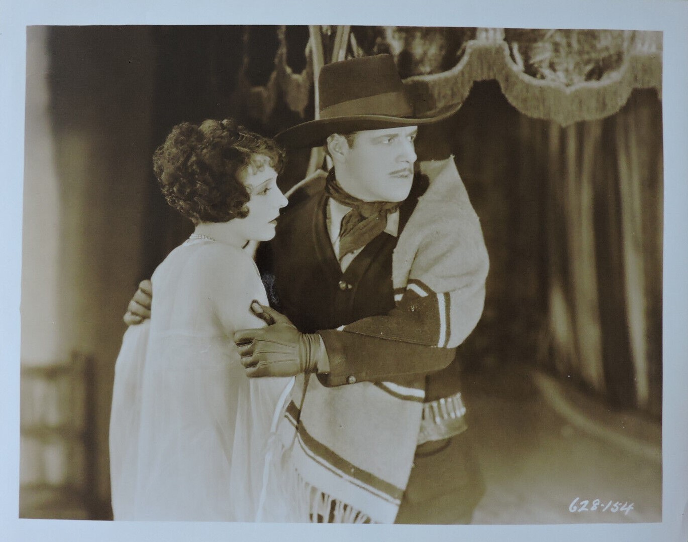 Jack Holt and Betty Jewel in The Mysterious Rider (1927)