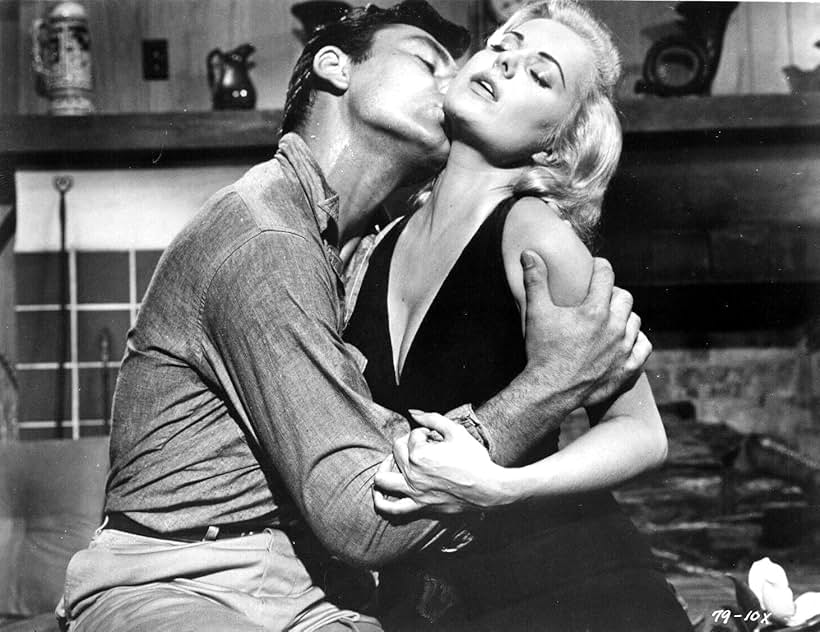 Martha Hyer and Ken Scott in Desire in the Dust (1960)