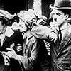 Charles Chaplin, Alice Howell, and Helen Carruthers in Mabel's Busy Day (1914)