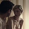 Claes Bang and Elizabeth Debicki in The Burnt Orange Heresy (2019)