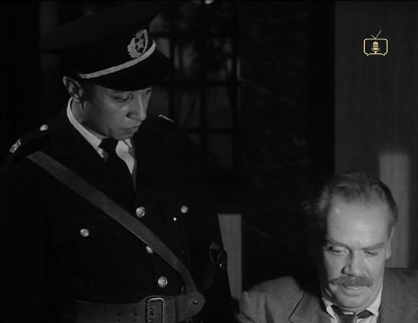 Peter Bathurst and John A. Tinn in Passenger to Tokyo (1954)