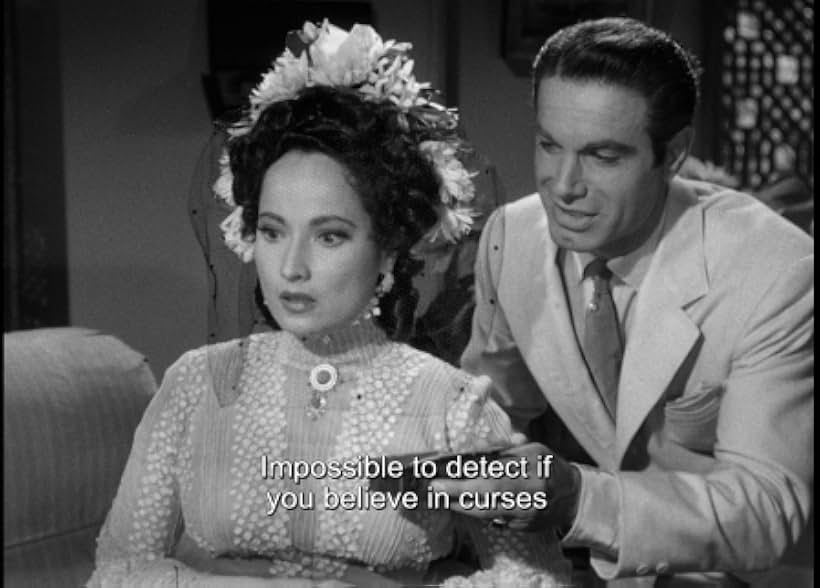 Charles Korvin and Merle Oberon in Temptation (1946)