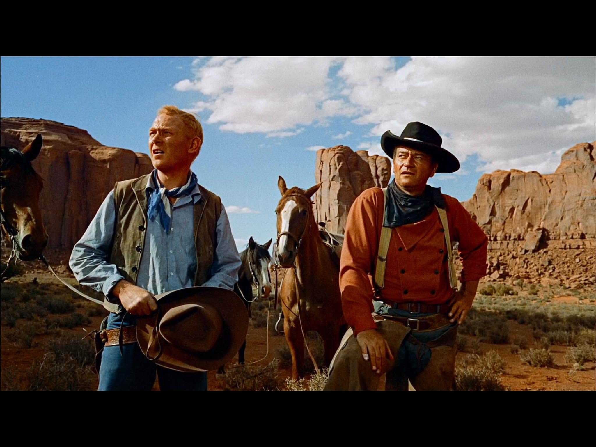 John Wayne and Harry Carey Jr. in The Searchers (1956)