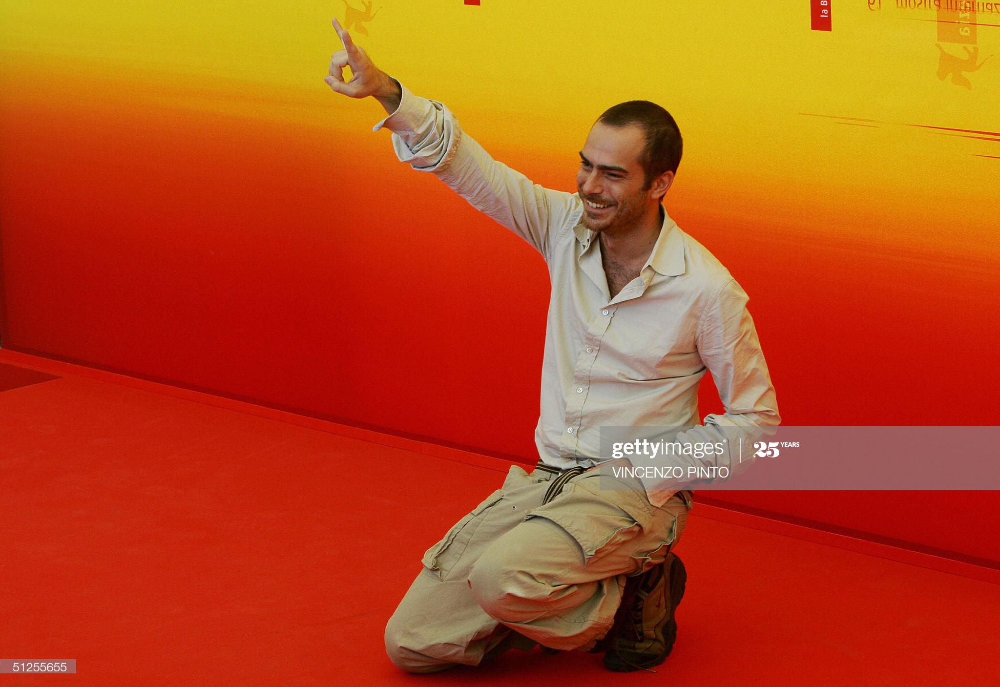 VENICE, ITALY: Greek actor Thanos Samaras gestures as he poses during a photo call at Venice Lido 2 September 2004. Samaras is in Venice to present in competition Nikos Panayatopoulos' movie 'Delivery'. The 61st Venice International Film Festival runs until 11 September with 21 films in competition for the Golden Lion main prize.