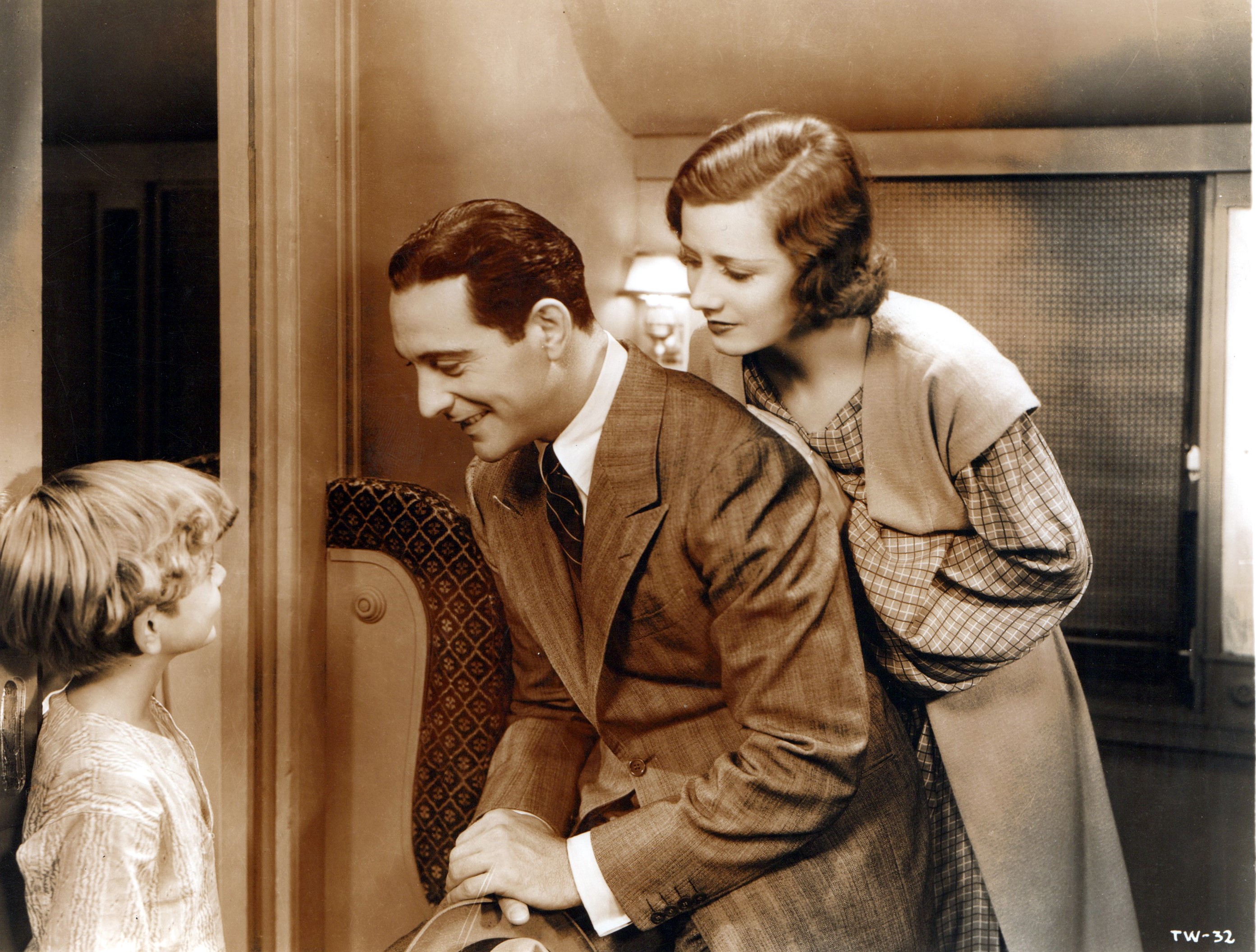 Irene Dunne, Ricardo Cortez, and Wally Albright in Thirteen Women (1932)