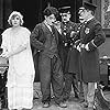 Charles Chaplin, George Cleethorpe, Fred Goodwins, Edna Purviance, and Leo White in Police (1916)