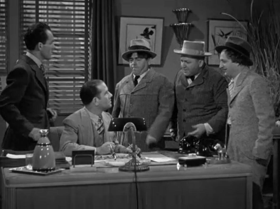 Moe Howard, Larry Fine, and Curly Howard in A Ducking They Did Go (1939)