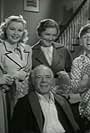 Mickey Rooney, Sara Haden, Fay Holden, Cecilia Parker, and Lewis Stone in Loews Christmas Greeting (the Hardy Family) (1939)