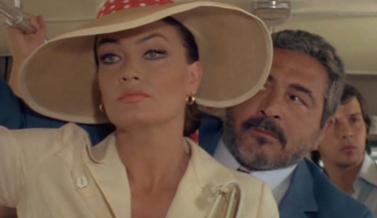 Marisa Mell and Renzo Montagnani in La liceale al mare con l'amica di papà (1980)