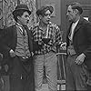 Charles Chaplin, Paddy McGuire, and Ernest Van Pelt in The Tramp (1915)