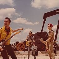 Mick Jones, Paul Simonon, Joe Strummer, and The Clash in The Clash: Rock the Casbah (1982)