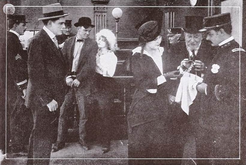 R. Henry Grey, Cleo Ridgely, Ruth Roland, and William H. West in Old Isaacson's Diamonds (1915)