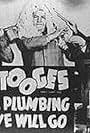 Moe Howard, Larry Fine, and Curly Howard in A Plumbing We Will Go (1940)