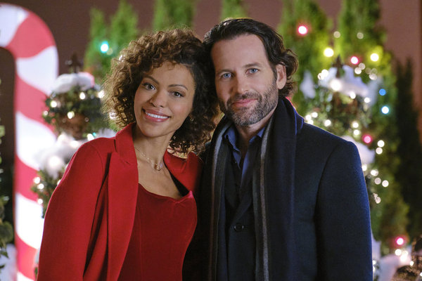 Eion Bailey and Alvina August in Deliver by Christmas (2020)