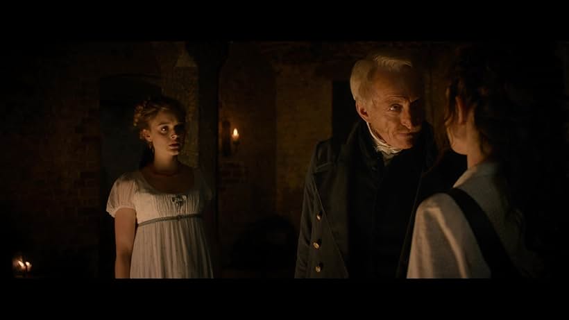 Charles Dance, Bella Heathcote, and Lily James in Pride and Prejudice and Zombies (2016)