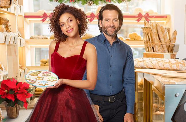 Eion Bailey and Alvina August in Deliver by Christmas (2020)