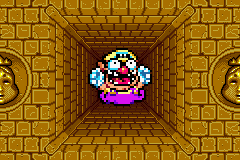 Wario falling down a precipice in the Golden Pyramid.