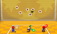 Mario, Luigi and Paper Mario attacking Goombas with Trio Racquet.