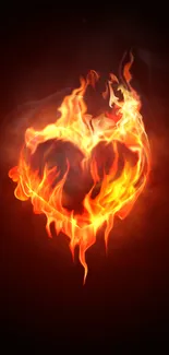 Fiery heart in flames against a dark background mobile wallpaper.