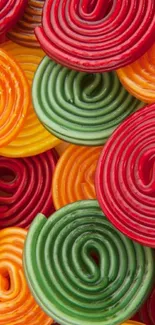 Vibrant and colorful candy spiral wallpaper for mobile screens.