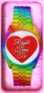 Rainbow watch with red heart on pink background.