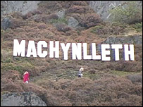 Big chipboard letters on a hill near Mach